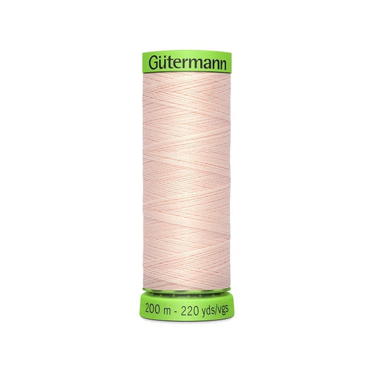 Spool of pale pink extra fine thread with Gutermann branding.