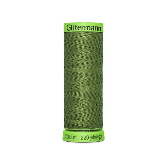Spool of dark green extra fine thread with Gutermann branding.