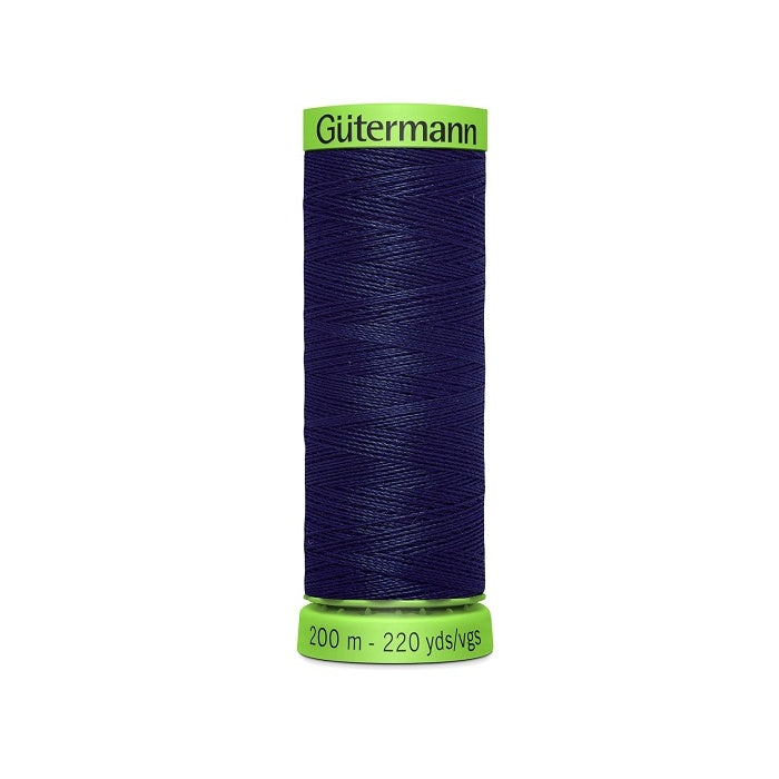 Spool of navy extra fine thread with Gutermann branding.