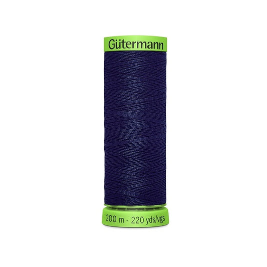 Spool of navy extra fine thread with Gutermann branding.