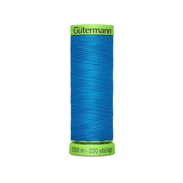 Spool of blue extra fine thread with Gutermann branding.