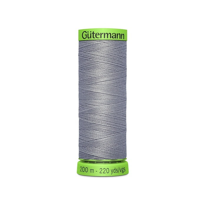 Spool of grey extra fine thread with Gutermann branding.