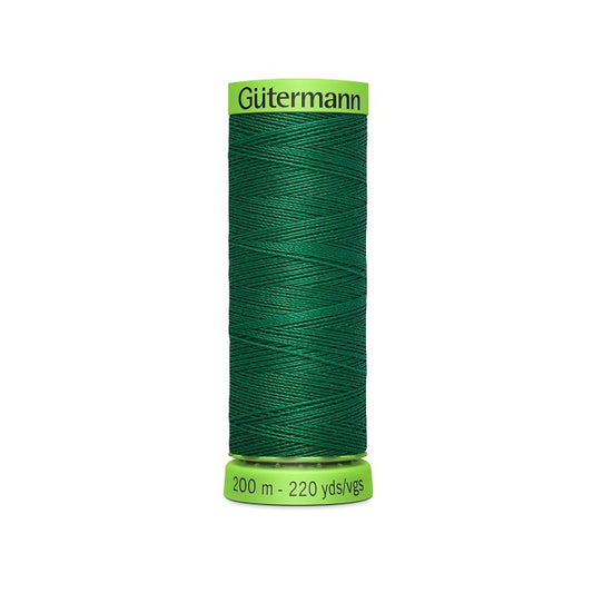 Spool of dark green extra fine thread with Gutermann branding.