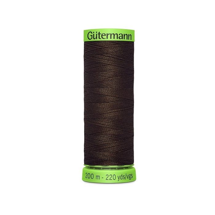 Spool of dark brown extra fine thread with Gutermann branding.