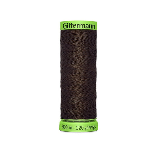 Spool of dark brown extra fine thread with Gutermann branding.