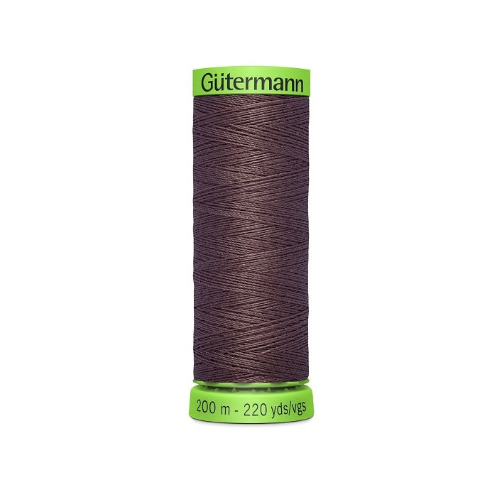 Spool of dark brown extra fine thread with Gutermann branding.