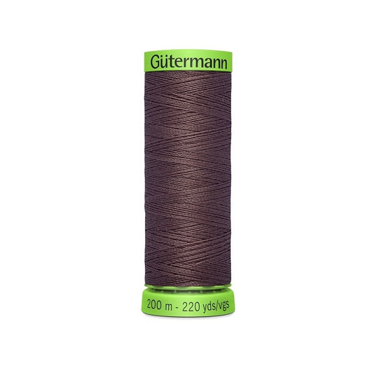 Spool of dark brown extra fine thread with Gutermann branding.