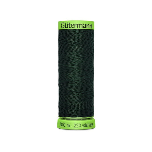 Spool of dark green extra fine thread with Gutermann branding.