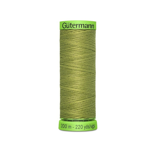 Spool of khaki green extra fine thread with Gutermann branding.