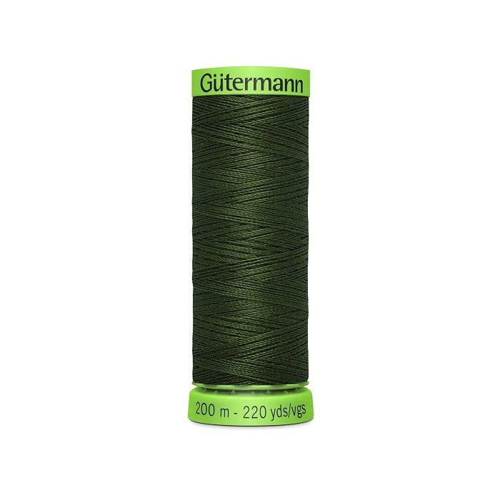 Spool of dark green extra fine thread with Gutermann branding.