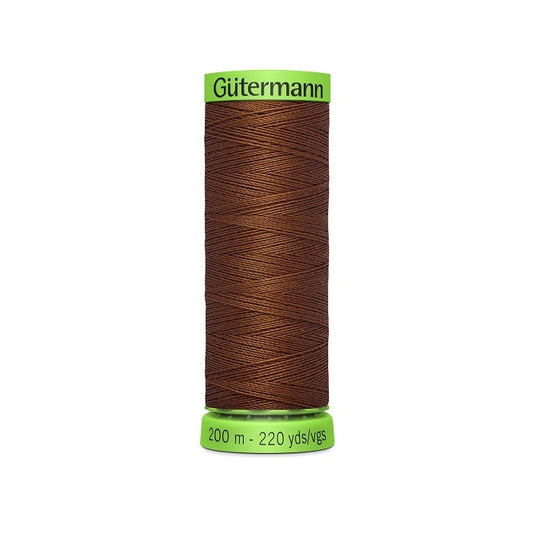 Spool of chocolate brown extra fine thread with Gutermann branding.