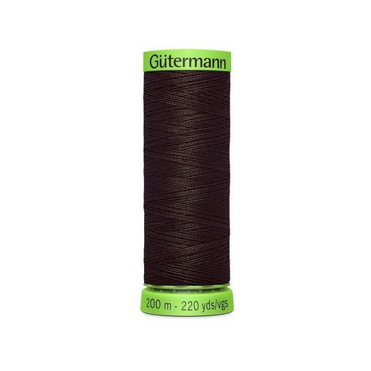 Spool of dark brown extra fine thread with Gutermann branding.