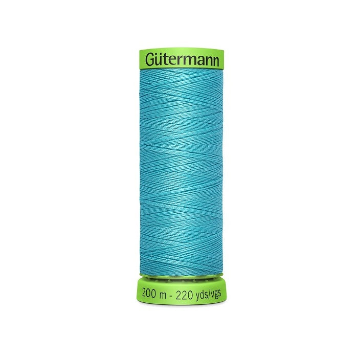 Spool of aqua blue extra fine thread with Gutermann branding.