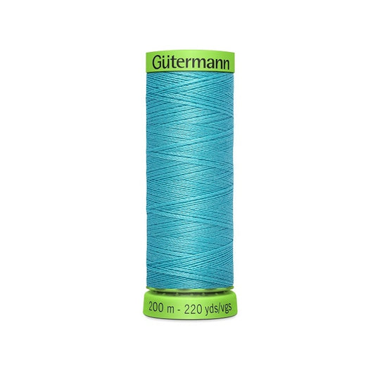 Spool of aqua blue extra fine thread with Gutermann branding.