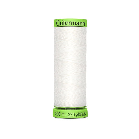 Spool of white extra fine thread with Gutermann branding.