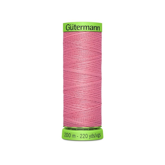 Spool of dark pink extra fine thread with Gutermann branding.