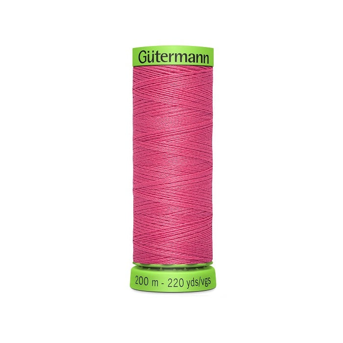 Spool of dark pink extra fine thread with Gutermann branding.