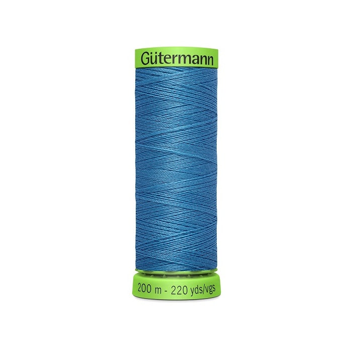 Spool of blue extra fine thread with Gutermann branding.