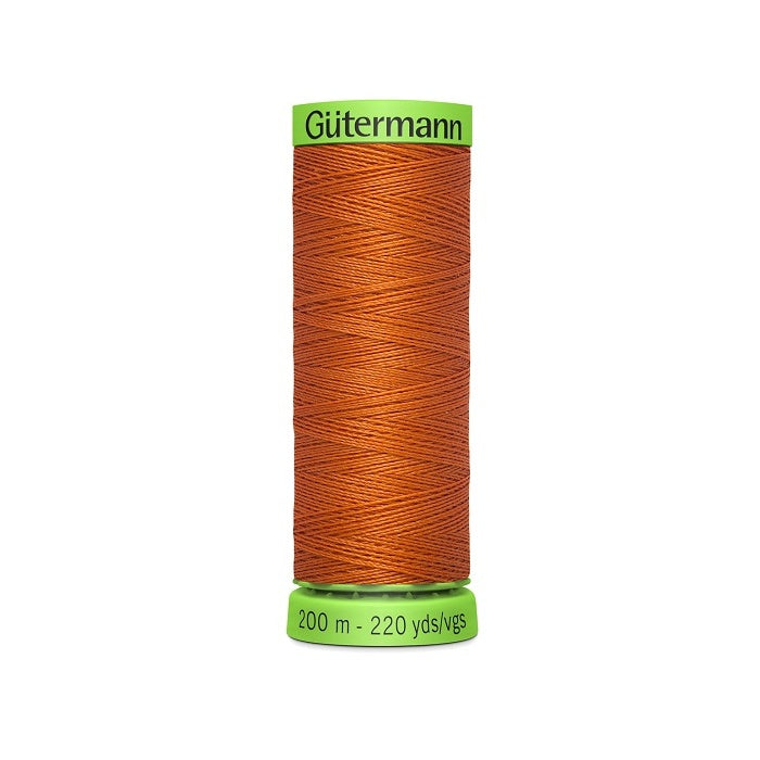 Spool of rust brown extra fine thread with Gutermann branding.