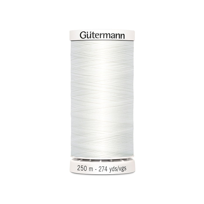White sewing thread spool with Gutermann branding.