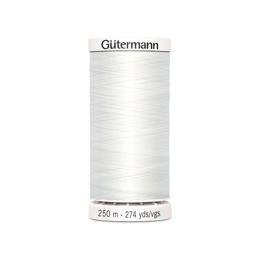 White sewing thread spool with Gutermann branding.