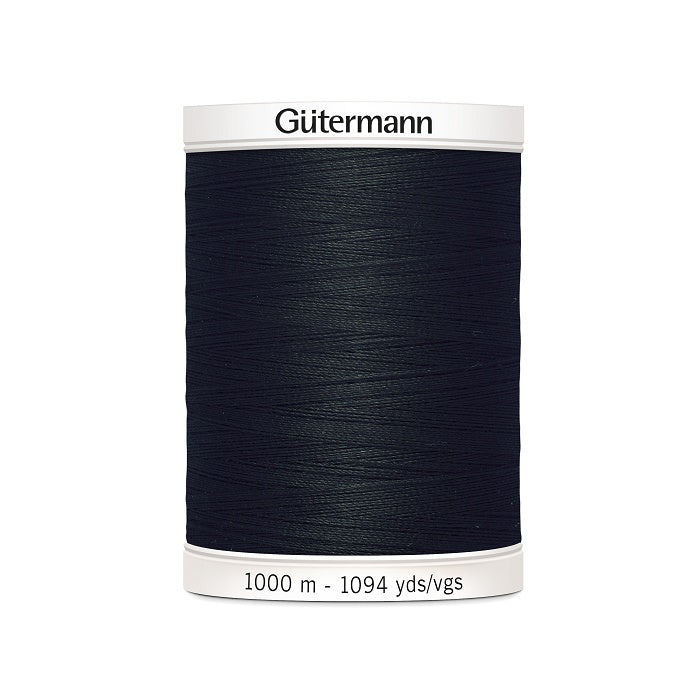 Black sewing thread spool with Gutermann branding.