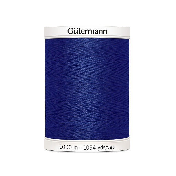 Navy sewing thread spool with Gutermann branding.