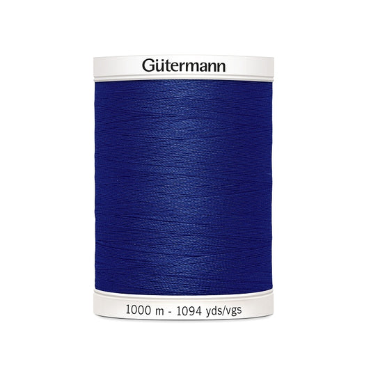 Navy sewing thread spool with Gutermann branding.