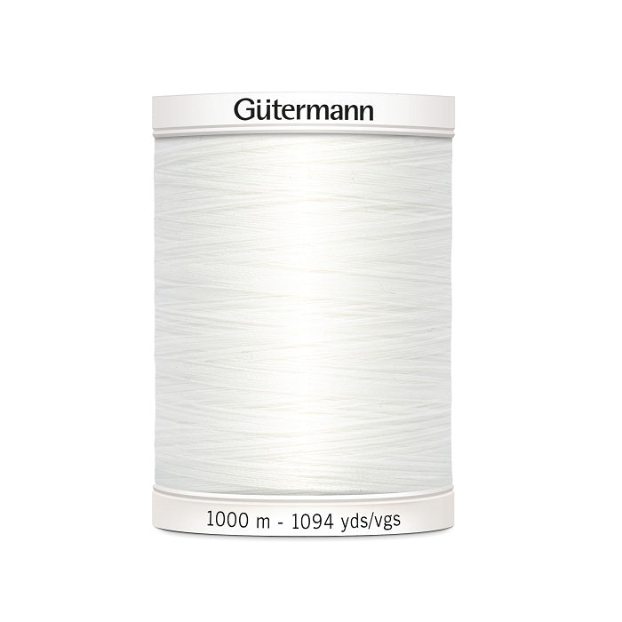 White sewing thread spool with Gutermann branding.