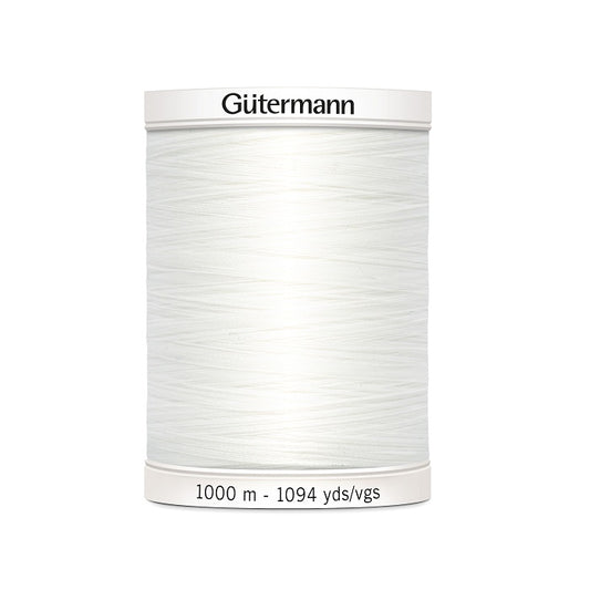 White sewing thread spool with Gutermann branding.