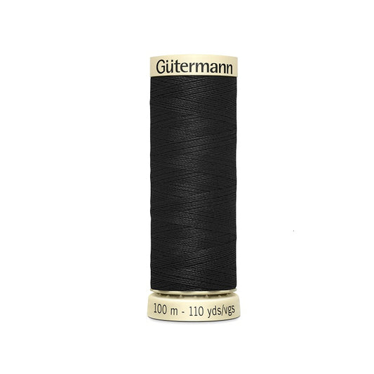 Spool of black thread with Gutermann branding.