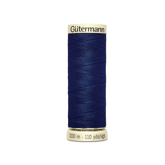 Spool of dark blue thread with Gutermann branding.