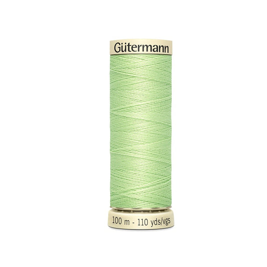 Spool of light green thread with Gutermann branding.