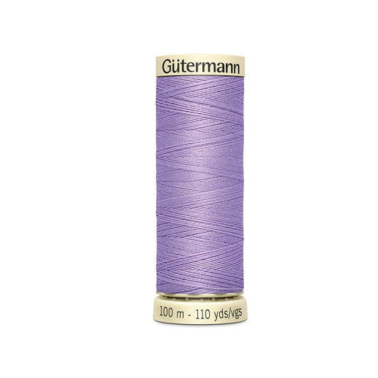 Spool of mauve purple thread with Gutermann branding.