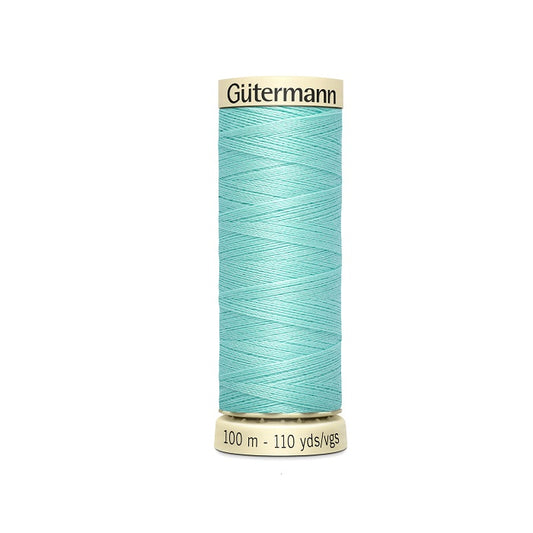 Spool of light blue thread with Gutermann branding.
