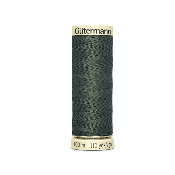 Spool of dark green thread with Gutermann branding.
