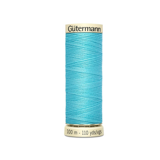 Spool of blue thread with Gutermann branding.