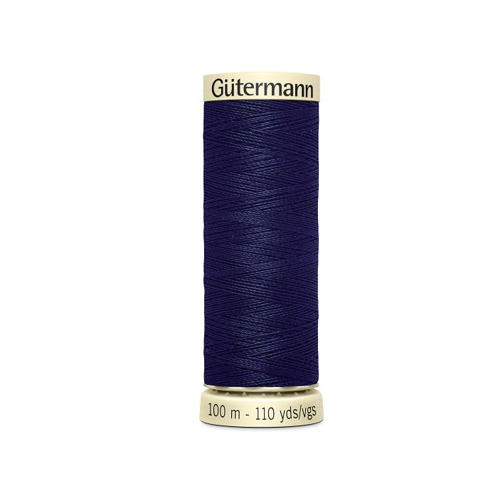 Spool of navy thread with Gutermann branding.