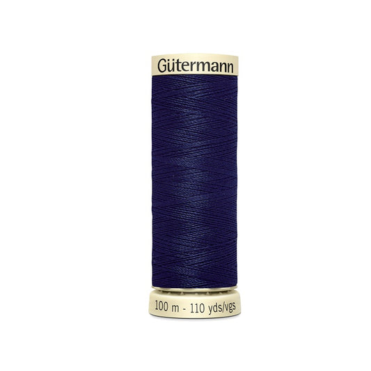 Spool of navy thread with Gutermann branding.
