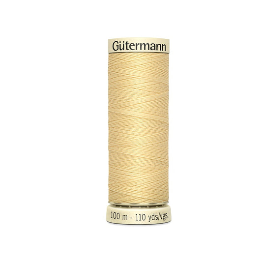 Spool of canary yellow thread with Gutermann branding.