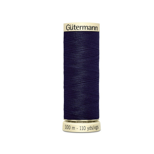 Spool of navy blue thread with Gutermann branding.