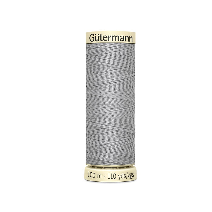 Spool of grey thread with Gutermann branding.