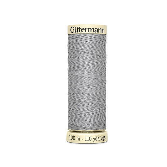 Spool of grey thread with Gutermann branding.