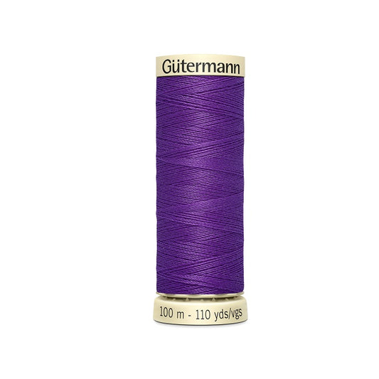 Spool of purple thread with Gutermann branding.