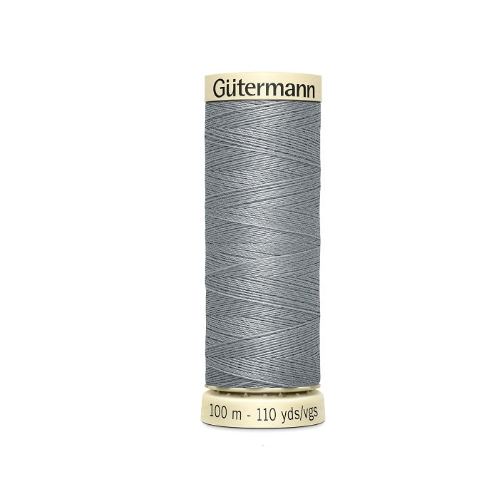 Spool of grey thread with Gutermann branding.