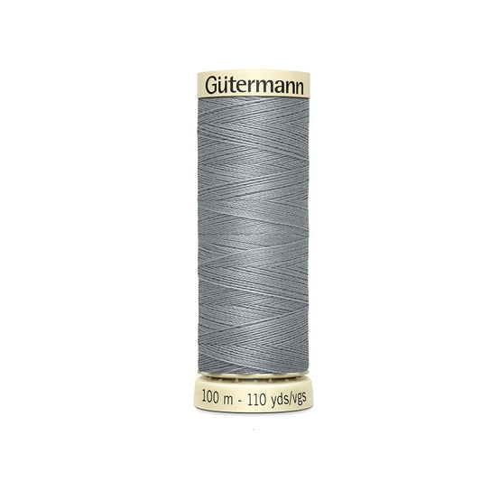 Spool of grey thread with Gutermann branding.