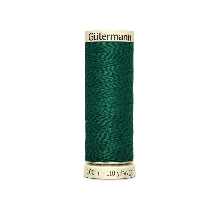 Spool of green thread with Gutermann branding.
