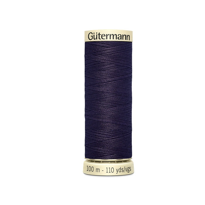 Spool of navy thread with Gutermann branding.