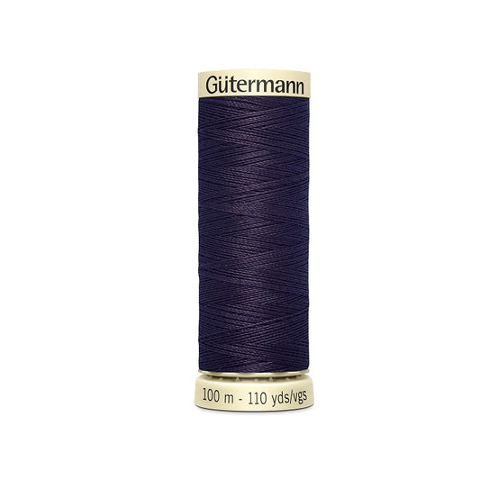 Spool of navy thread with Gutermann branding.