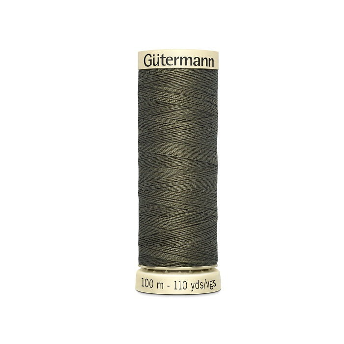 Spool of dark olive green thread with Gutermann branding.